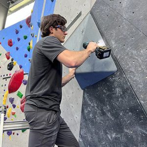 Route setter at an indoor rock climbing gym